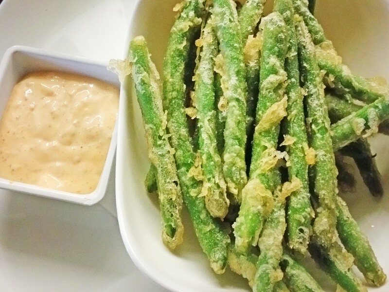 These fried green beans in Togarashi sauce have the bright crispiness of the green bean along with the devilish crunch from frying, accented by a creamy concoction that will keep you dipping for more!