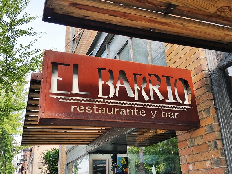 El Barrio's rustic sign