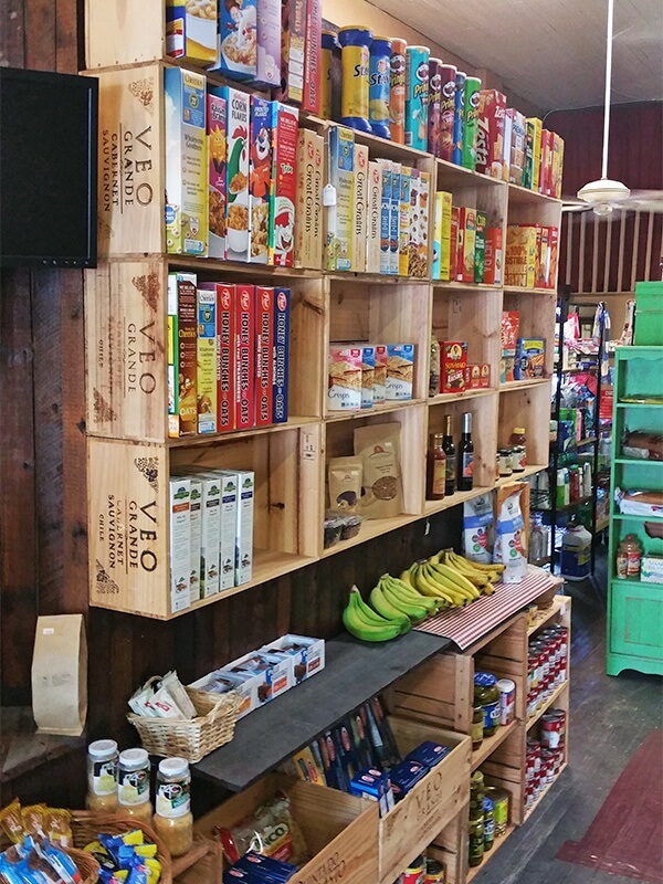 The colorful and well-organized interior of Mamanoes Grocery Shop