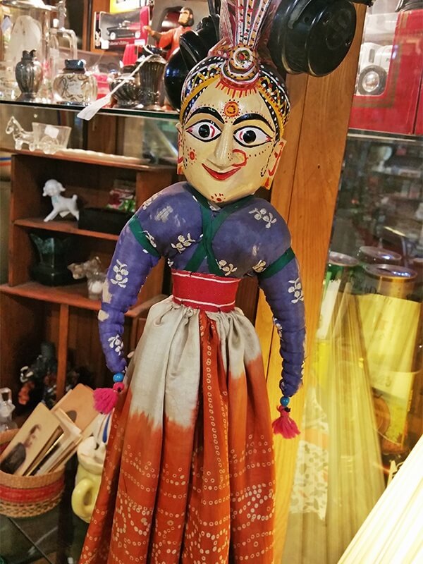 Boldly colored Indian doll displayed in What's on 2nd