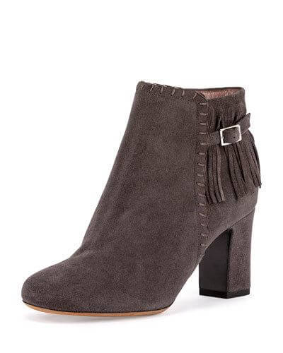 These are pretty amazing. With a 3-inch heel, whip stitched front trim and fringe around the back half, held tight with an adjustable buckle, these gray booties by Tabitha Simmons are pretty fabulous. They cost a pretty penny at $895. For details, click here.