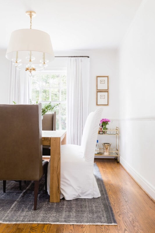 This Renovated Cottage Has Big Appeal - 6 White fabrics dominate the dining room, keeping it clean and fresh. photo credit: @AlyssaRosenheck