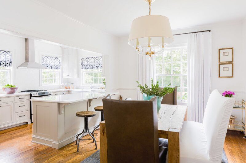 This Renovated Cottage Has Big Appeal - 8 The kitchen and bar open seamlessly onto the dining area, creating a much larger space for serving and eating with friends and family. photo credit: @AlyssaRosenheck