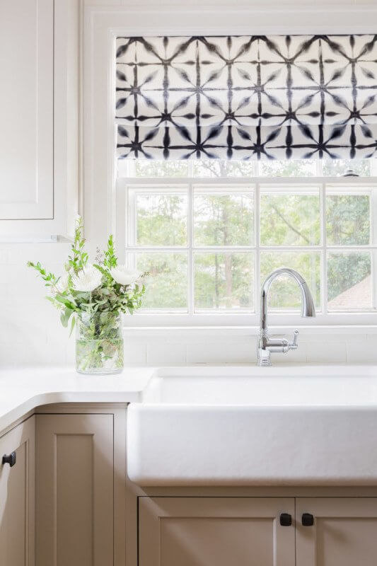 This Renovated Cottage Has Big Appeal - 10 The intimate kitchen looks out over the backyard and provides plenty of preparation and storage space. photo credit: @AlyssaRosenheck