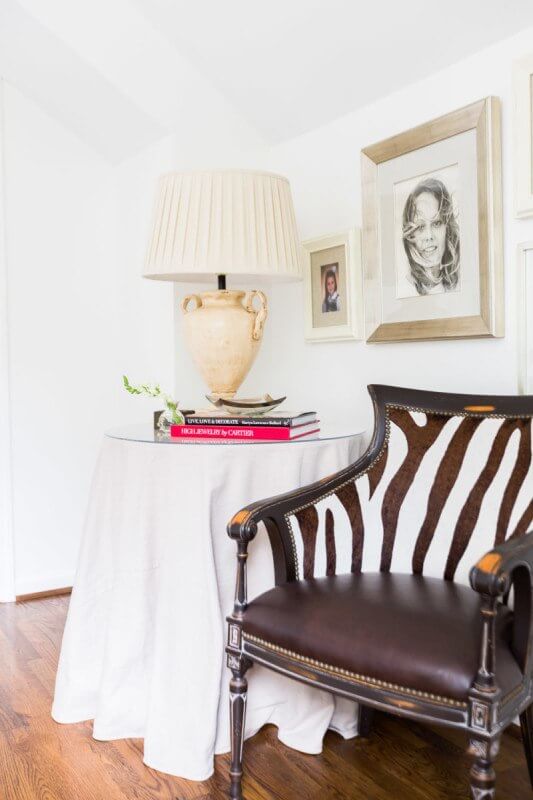 This Renovated Cottage Has Big Appeal - 12 The upstairs landing is covered in family heirlooms, like old photographs. photo credit: @AlyssaRosenheck