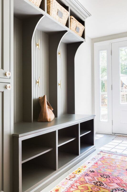 This Renovated Cottage Has Big Appeal - 17 These painted wooden cubbies are not only a chic wall accent, they provide a great option for storing odds and ends. photo credit: @AlyssaRosenheck
