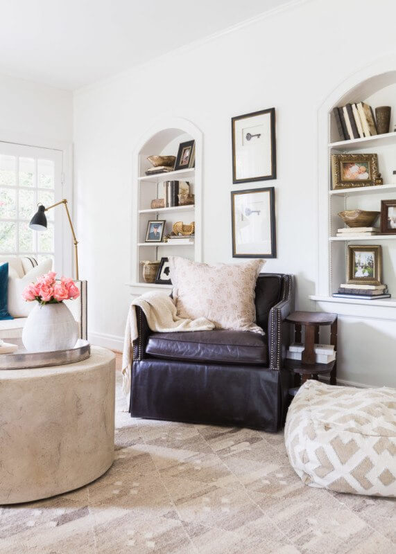 This Renovated Cottage Has Big Appeal - 5 Decorating the shelves with books and vintage totems, Julie brings livelihood into the space. photo credit: @AlyssaRosenheck