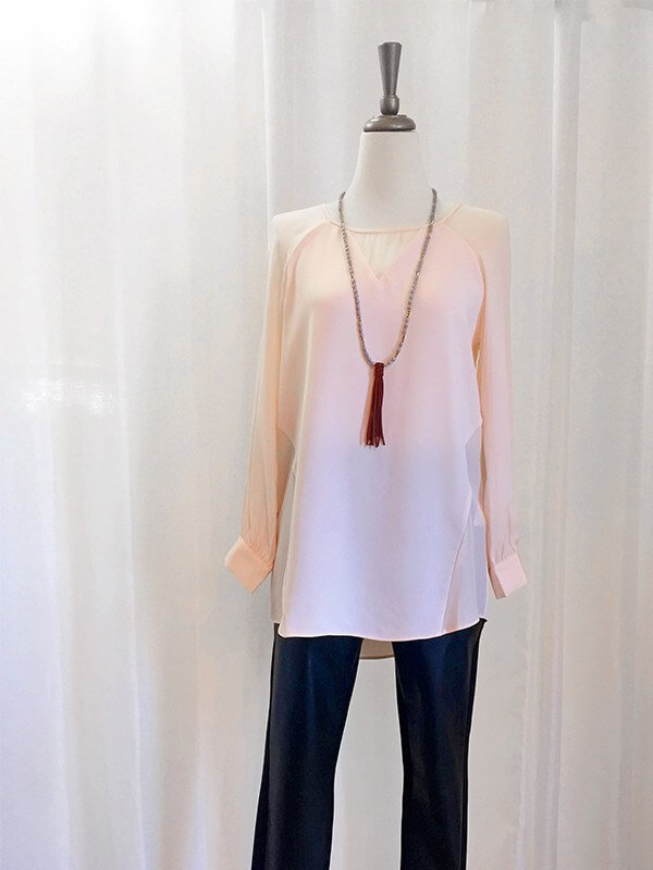 Add edge to a sophisticated top with a dynamic necklace. From "What to Wear - Nashville Events"