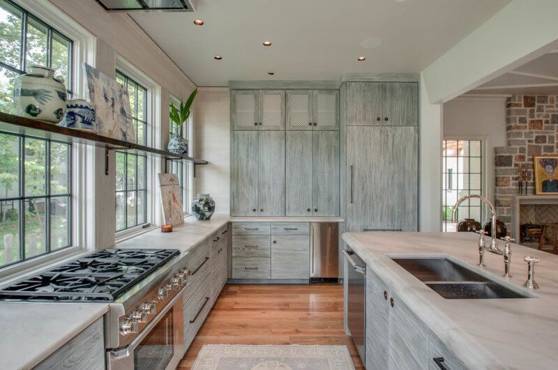 With a full wall of windows and cabinets on either side, there is at once ample storage and light ... something hard to find in most homes.