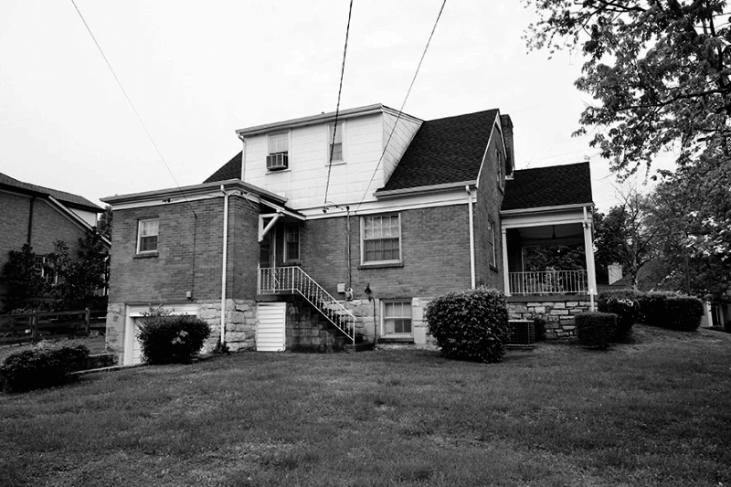 This photograph illustrates the back of the house prior to renovation.