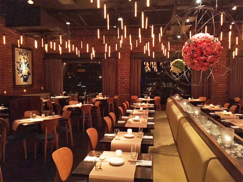 ONE. midtown kitchen is a hip space where the kitchen is open, and there's a modern but romantic vibe (think exposed brick, modern but cozy furniture, brown paper table runners, and a killer patio overlooking the green space in ONE's backyard).