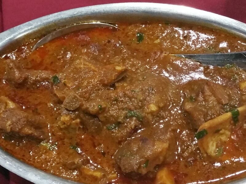 This goat curry is so tender it falls off the bone. Sop up the spicy and savory sauce with garlic naan before falling into a blissed out foodie coma.