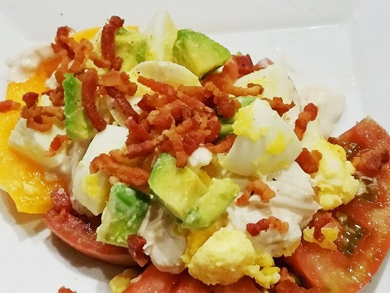 The Crab Louie salad incorporates sweet chunks of crab over beefsteak tomatoes with avocado, hickory-smoked bacon and chopped hard-boiled egg.