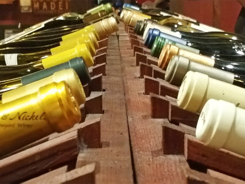 Racks of wine line the interior of the wine bar, where diners can walk around and choose a bottle that strikes their fancy.