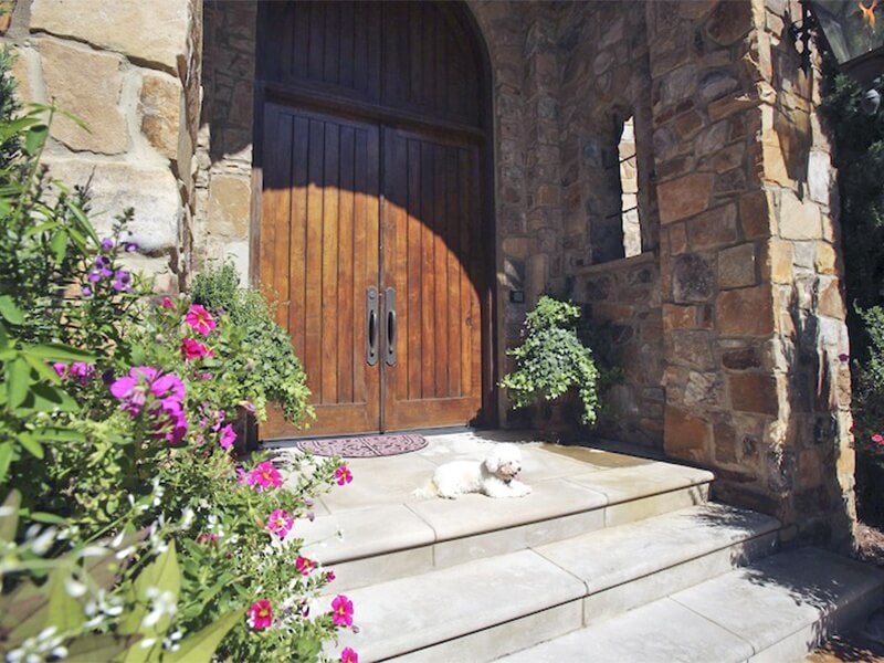 Custon-crafted of European Oak by Southern Accents, these one-of-a-kind doors lend a touch of antique charm.