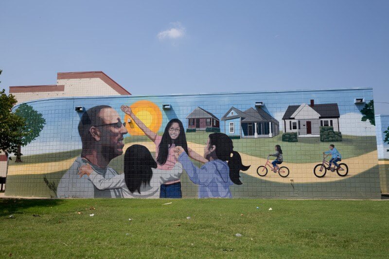 Artists Mark and Megan Davey created this uplifting mural on the side of the Lester Community Center on Tillman. It showcases the variety of activities available at the Lester Community Center.