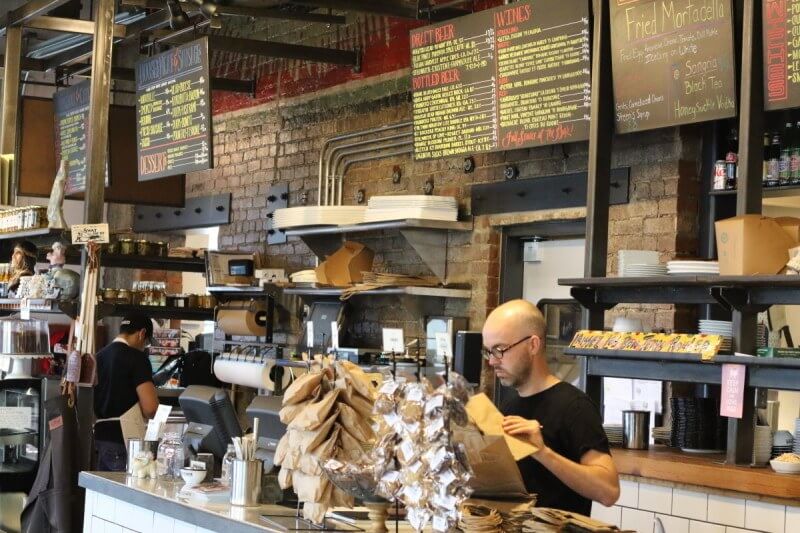 Cochon Butcher Counter: The counter where you order has extra enticements like freshly fried potato chips, cookies and bacon brittle.