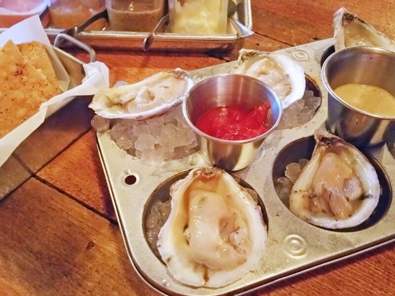 The stellar oysters at 5 Point Public House Oyster Bar are accompanied by house-made crackers, as well as five house-made sauces, including a fantastic hot sauce!