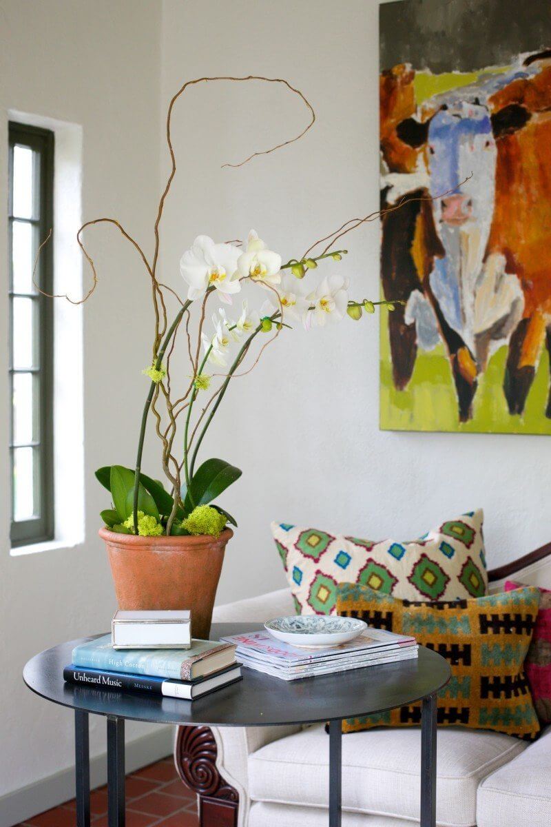 Live plants always lend a cheerful energy to any space, and the foyer is the perfect spot to place them.