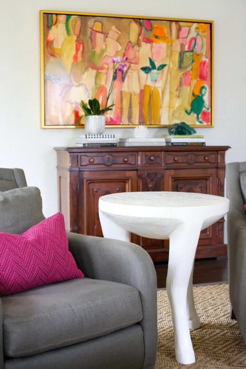 HANNON DOUGLAS Designers Hannon Kirk Doody and Doug Davis incorporated a smart, playful mix of antique pieces and modern touches throughout the home. Here, an antique sideboard juxtaposes nicely with a modern hoof-legged side table by Oly.