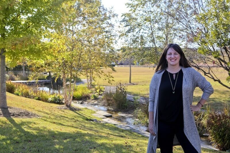 Lea Ann Macknally: FACES of Birmingham - 3 Lea Ann Macknally stands before a picturesque stream that runs through Railroad Park.