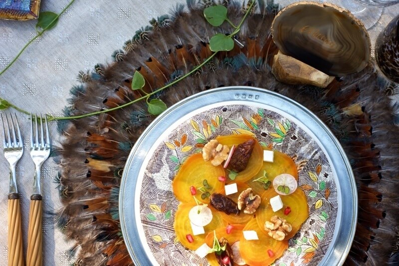 Chef George's beautiful fall appetizer looks gorgeous juxtaposed against the rustic feather place mat and Alain Saint Jonais flatware with petrified wood handles.