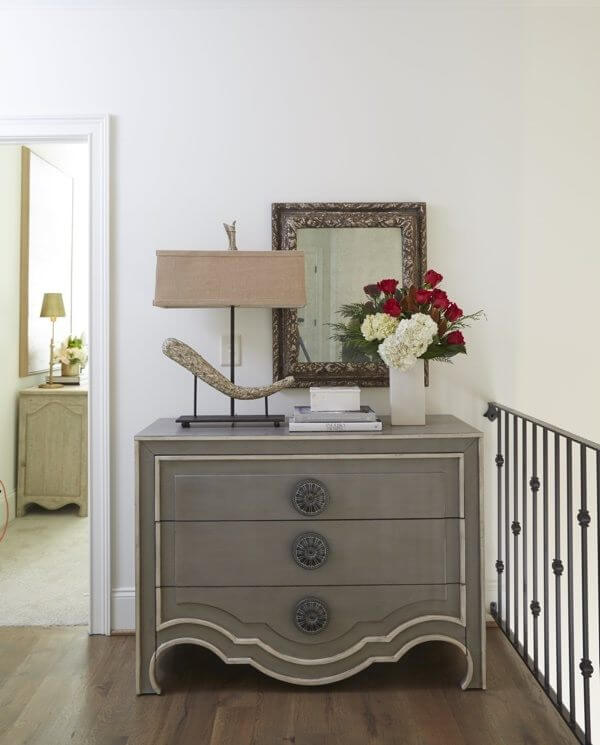 Hallways don’t have to be relegated to dead space. An elegant dresser styled with a few unique accessories adds instant personality to your home and provides additional storage as well.