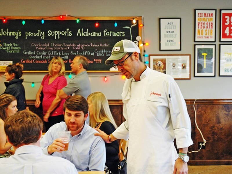 Chef Tim checks in with some regular customers.