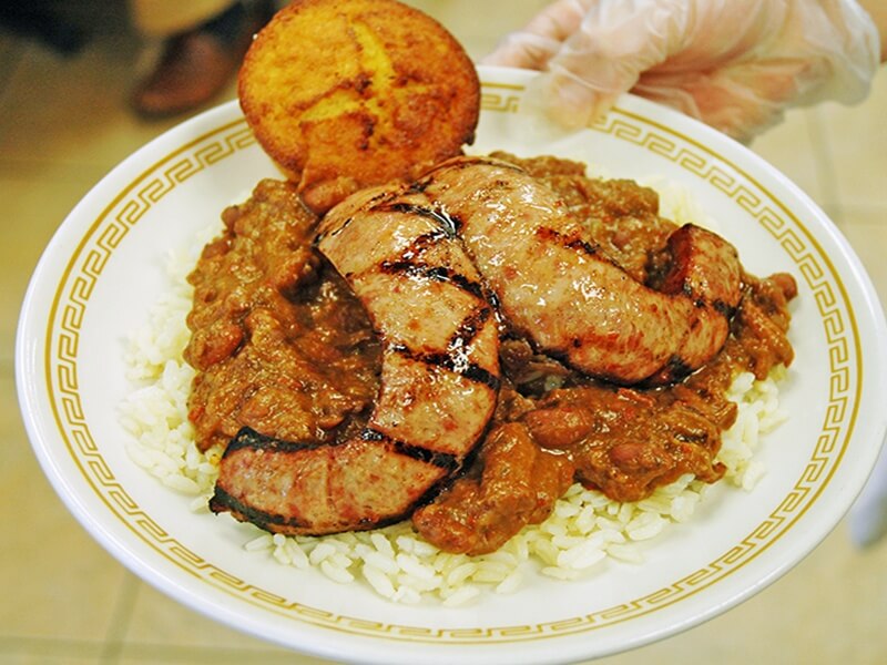 Grilled conecuh sausage over red beans and rice, served with cornbread