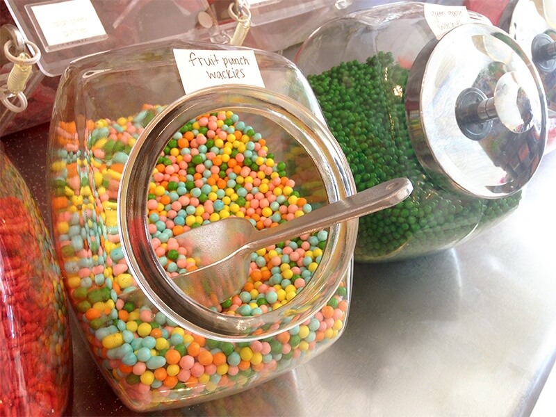 Stainless steel candy scoops give a nod to the vintage inspiration in the space.