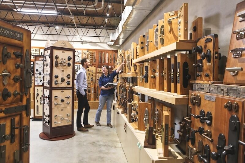 Renee Généraux helps a client navigate his many choices in the Brandino Brass showroom.