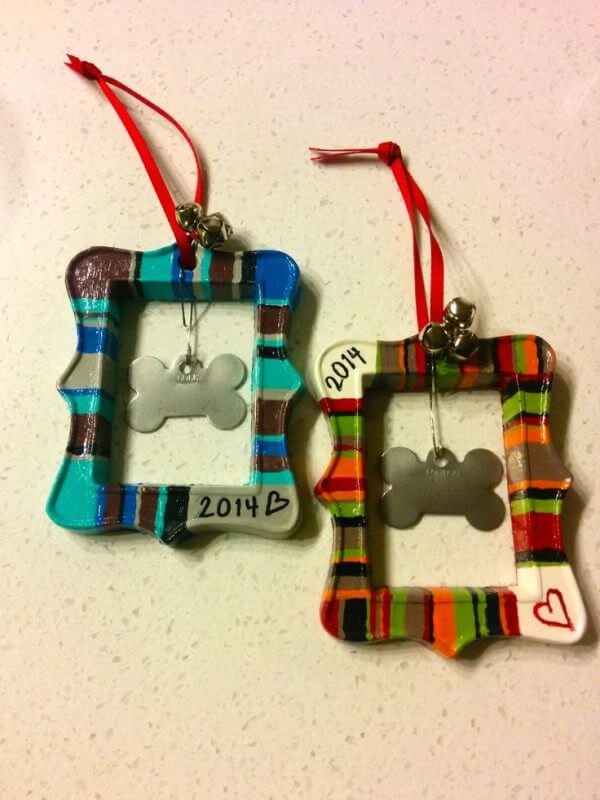 You can get fancy and buy some of these frames and the craft store, decorate them, and add bells and ribbons. OR you can add the ribbon through the hole and have that be your ornament! You can also leave the tag on your beloved pet's collar and hang straight to the tree. Image: Pinterest.