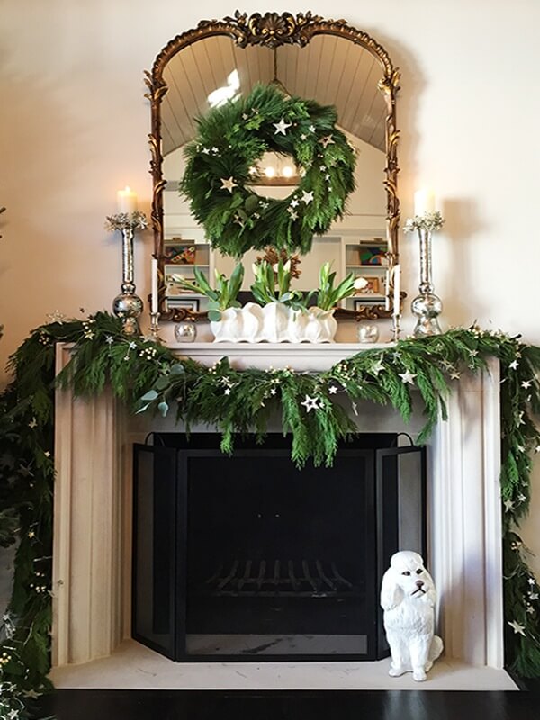 The consistency of the metallics, whites and greenery throughout take this mantel design to the next level.