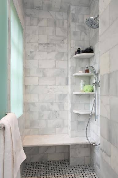 Marble tile shower with bench and sprayer is a great move for the aging population Tile shower with bench and sprayer