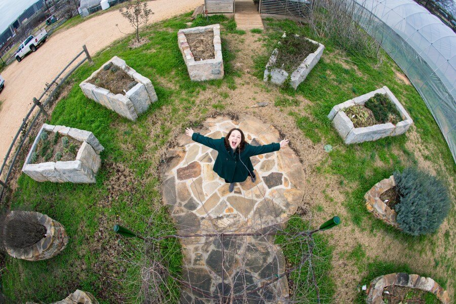 Amanda Storey goofs off for the fish-eye lens at Jones Valley Teaching Farm. Amanda Storey