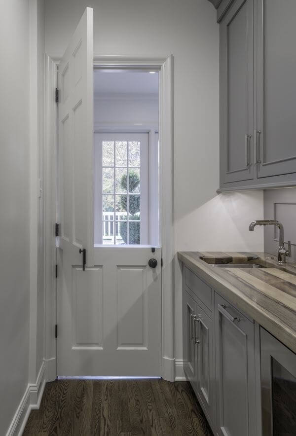 The Dutch door between the new butlerâs pantry and the rear hallway opens to a back deck. That single touch means the space can be completely closed off to hide messy prep work during a party, or left âhalf openâ for serving guests. Dutch door in Memphis kitchen