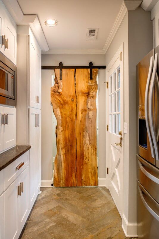 Have you seen a better looking door? Raw edge wooden door in this fabulous kitchen