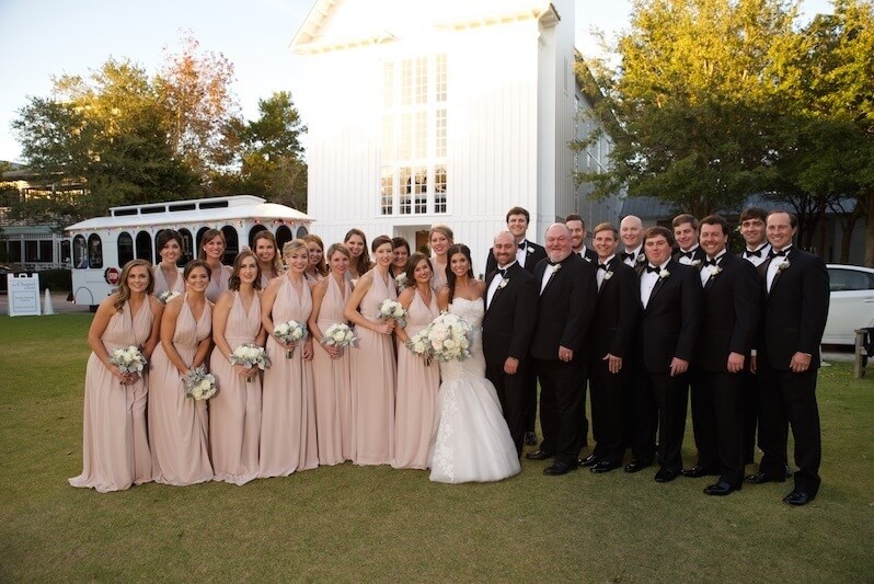 That's 14 bridesmaids! There’s nothing more southern than a big bridal party. The bridesmaids are stunning in their nude Joanna August gowns from Bella Bridesmaids.