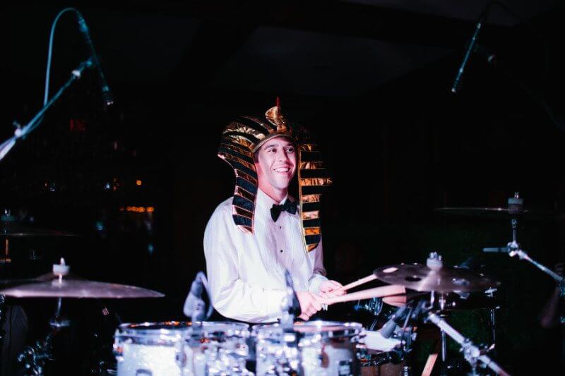 groom playing drums