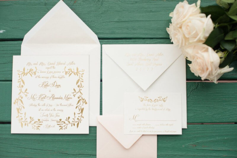 The wedding invitation was custom designed b =y FILL IN
