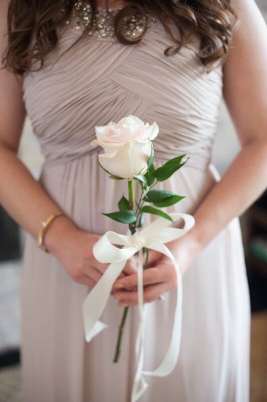 The bridesmaids each carried a single, beautiful rose.