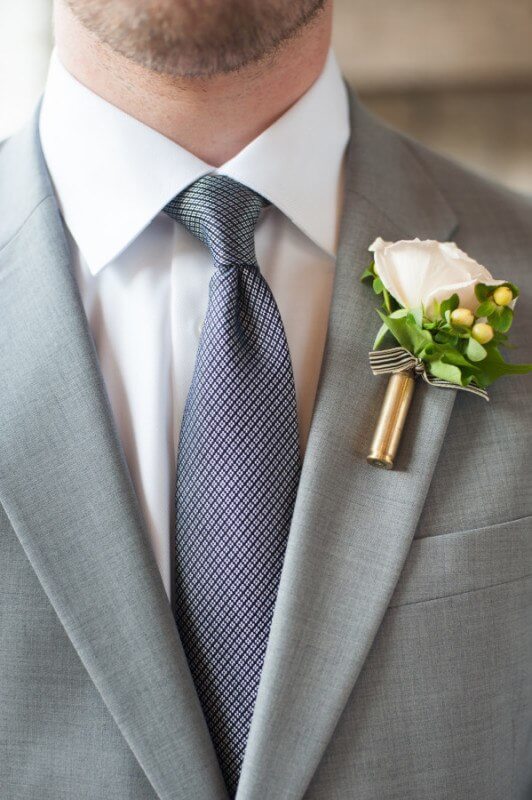 One of the details is the use of a shotgun shell in the boutonnieres. Kurt wanted a Southern touch for the guys as well.