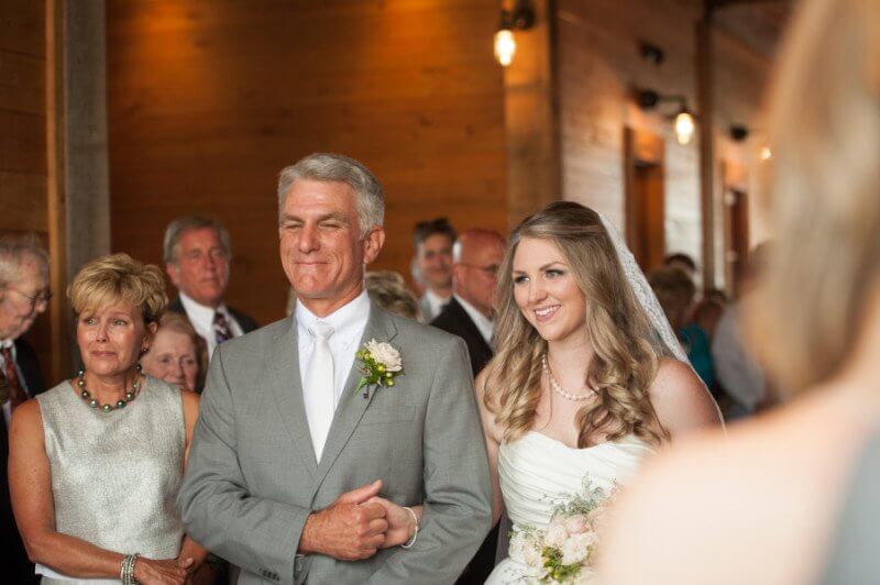 Katie only has eyes for Kurt as she nears the alter. 