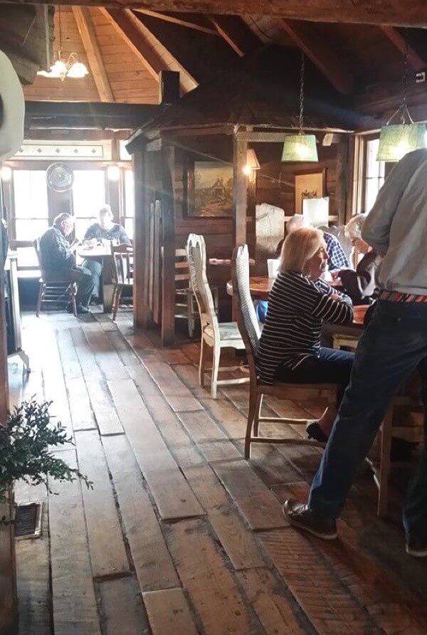 The inside of the 1800s cabin that houses the Green Leaf Grill Green Leaf Grill