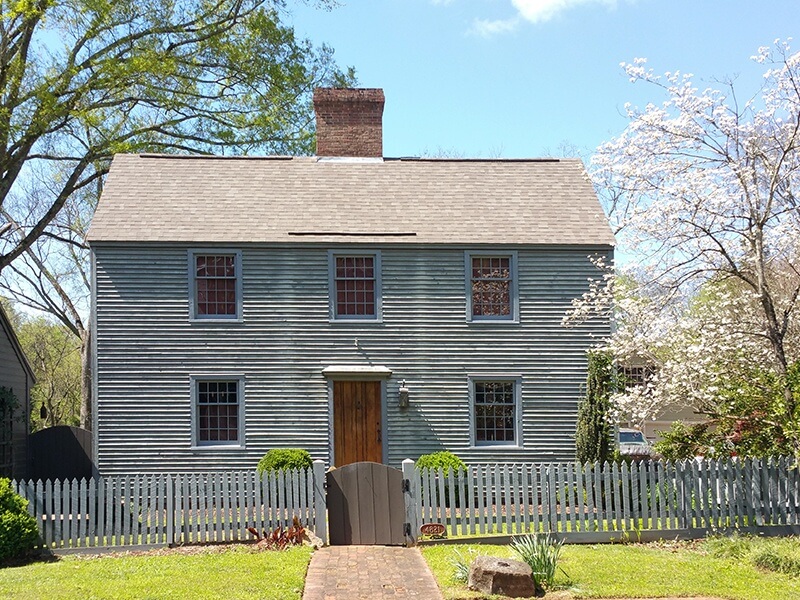 Now a residence, this 1780-style saltbox house was built circa 1854 and was originally the site of the Martin-Smith Blacksmith and Cabinet Shop.