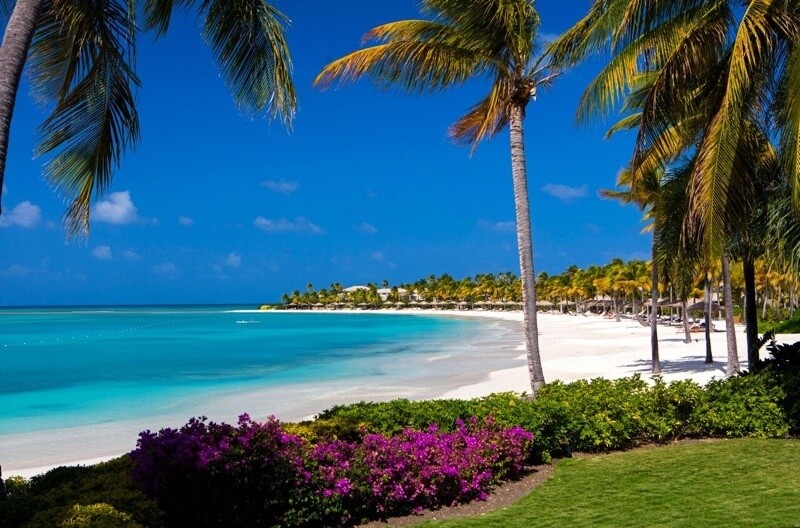 A bathing suit is a style staple at Jumby Bay. "Beyond light-weight beach attire and a few outfits for dinner, you really don’t need to bring much," says Ashley Smith, associate director of sales and marketing at Jumby Bay. Image: Jacob Termansen