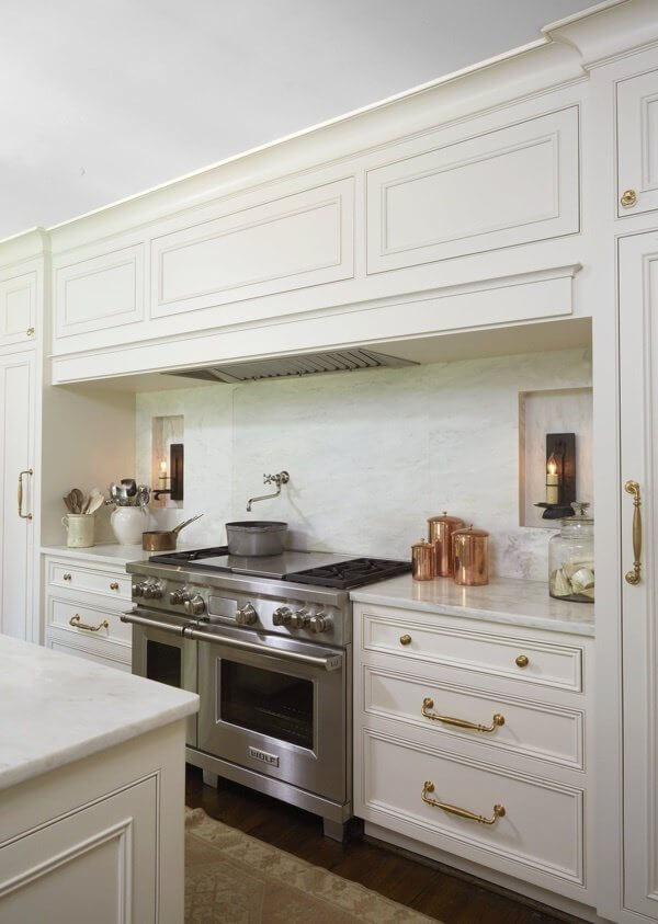 "We chose the 48-inch Wolf Range with a grill and a griddle and opted for the Stainless knob instead of their signature red knobs to keep everything very subdued and soft," says Cyndy. "We chose the 48-inch Wolf Range with a grill and a griddle and opted for the Stainless knob instead of their signature red knobs to keep everything very subdued and soft," says Cyndy.