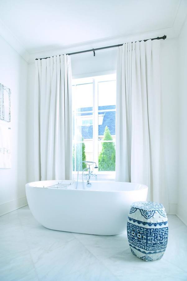 Rethink the window treatments in your bathroom to create a sophisticated look