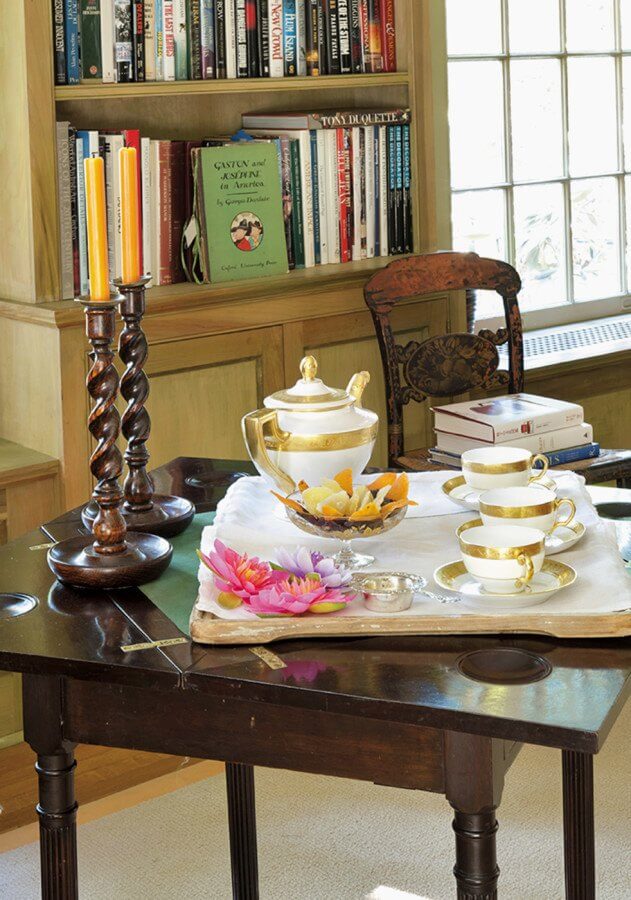 "A fine French porcelain tea set that belonged to [Florence de Dampierre's] grandmother lends an elegance to the tea tray set on her grandfather’s 19th-century mahogany game table," says Susan.