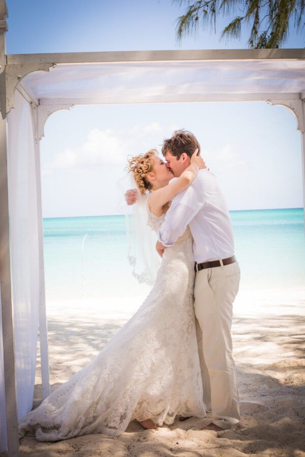 The newlyweds share their first kiss as husband and wife.
